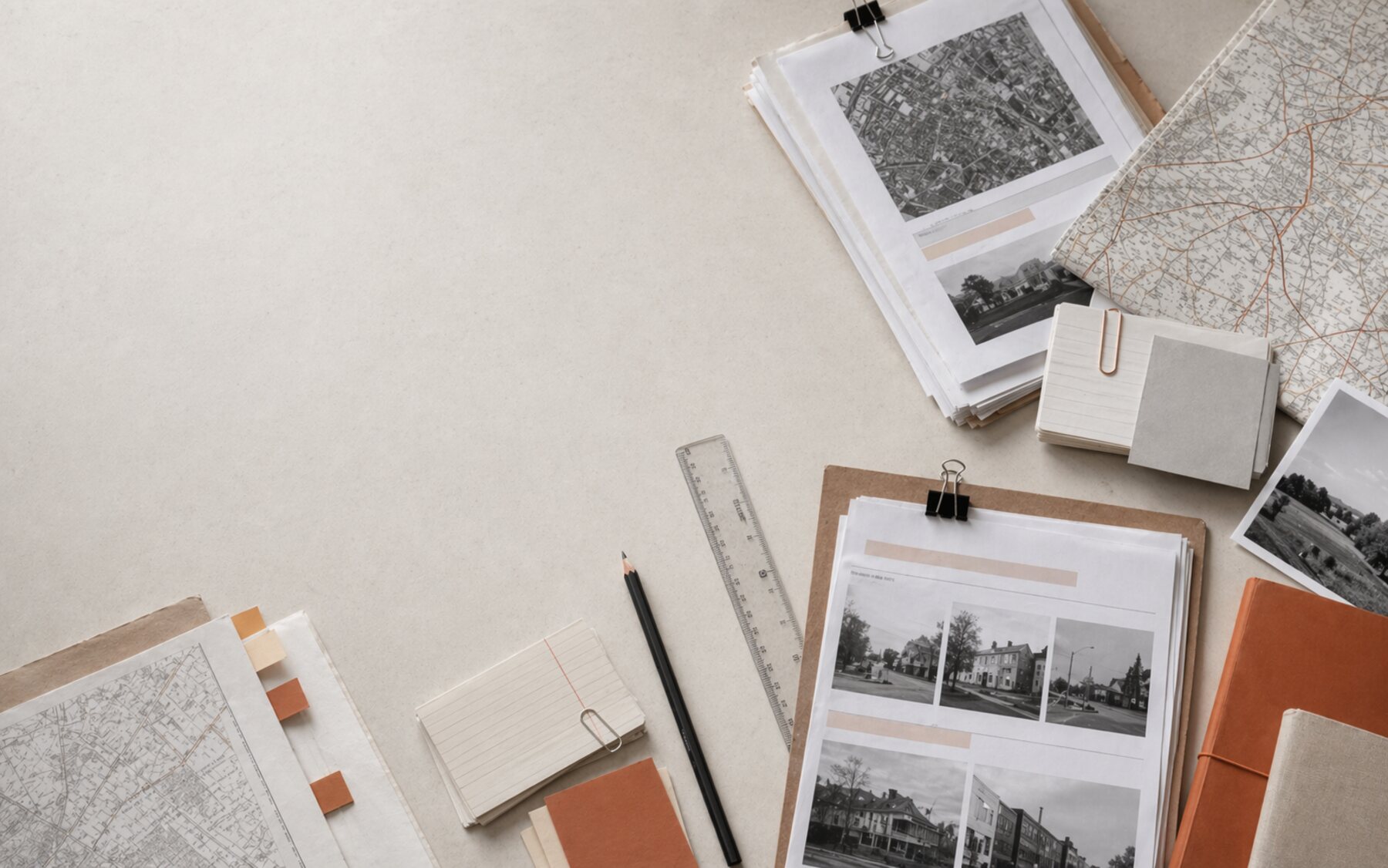 Editorial source verification table with council papers, maps, index cards, and clipped documents.